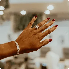 An elegant red manicure with sculpted nails photographed inside the salon